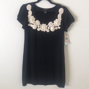 Black tunic dress with cream floral applique